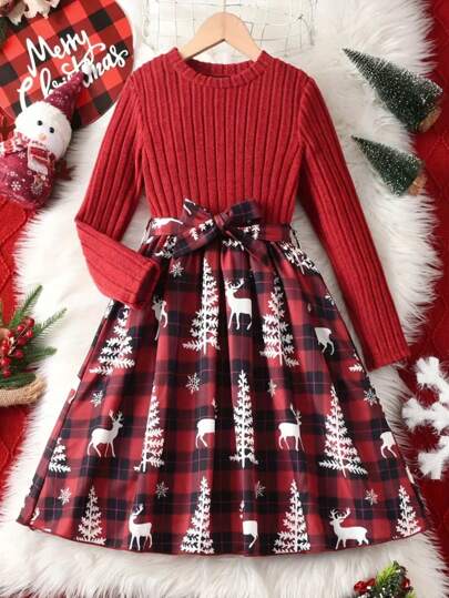 An Elegant And Stylish Girl In A Cute Long-Sleeve Christmas Outfit Featuring A Print Waist And A Flared Skirt.