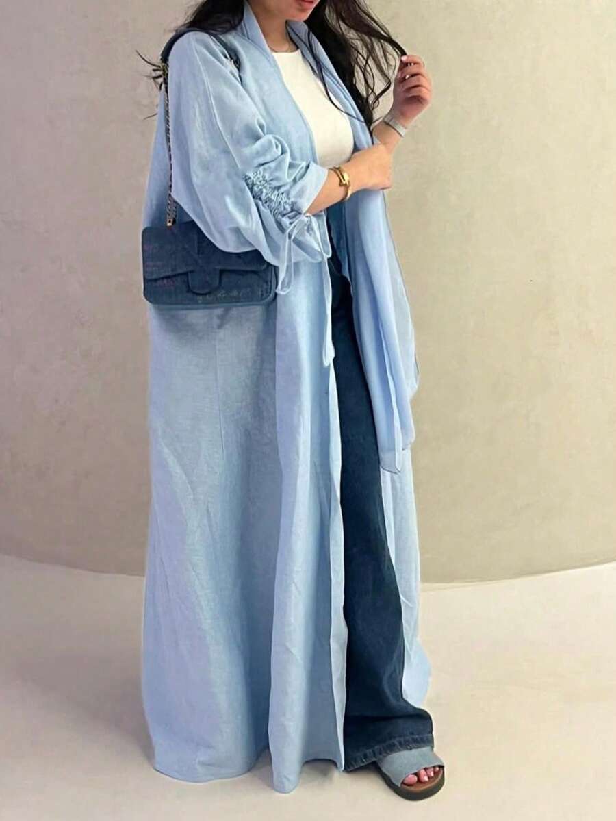 这款优雅经典的极简主义抽绳袖口女式睡袍散发着高贵典雅的气息，适合所有季节和各种文化活动。 - 淺藍色 - 查看 1