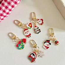 Un paquete de 5 llaveros de metal navideños, decoraciones de ambiente, pequeños colgantes, mochilas de estudiantes, decoraciones colgantes, pequeños regalos para dar a los compañeros de clase, regalos de Navidad