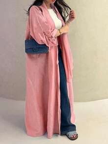 Chiếc áo choàng nữ cổ điển thanh lịch với dây rút ở cổ tay này toát lên vẻ quý phái và duyên dáng, phù hợp cho mọi mùa và nhiều sự kiện văn hóa khác nhau. - Hồng - Xem 1