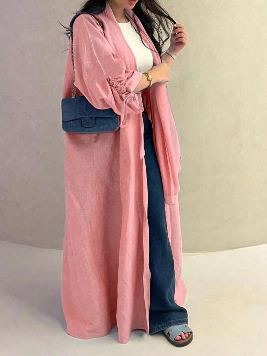 Chiếc áo choàng nữ cổ điển thanh lịch với dây rút ở cổ tay này toát lên vẻ quý phái và duyên dáng, phù hợp cho mọi mùa và nhiều sự kiện văn hóa khác nhau. - Hồng - Xem 1