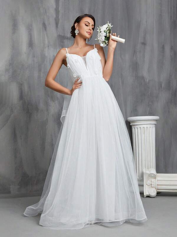This Women's Wedding Dress Features Delicate Spaghetti Straps, Intricate 3D Floral Decorations, And A Classic A-Line Silhouette, Creating An Elegant And Charming Style. It Is Perfect For Wedding Ceremonies, Grand Church Weddings, Formal Wedding Receptions, Elegant Bridal Photoshoots, And Luxurious Destination Weddings.