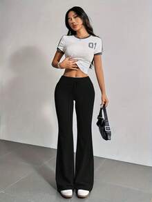 Pantalones deportivos con cintura de cordón y pierna acampanada