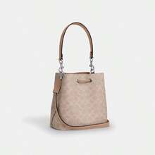 Coach Túi xách nữ Rowan 22 bằng da mềm, kiểu dáng xô, túi đeo chéo, túi đeo vai, ví cầm tay thanh lịch, túi xách có ngăn đựng tiền lẻ. - Vàng cát với màu nâu nhạt - Xem 7