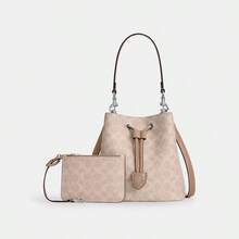 Coach Túi xách nữ Rowan 22 bằng da mềm, kiểu dáng xô, túi đeo chéo, túi đeo vai, ví cầm tay thanh lịch, túi xách có ngăn đựng tiền lẻ. - Vàng cát với màu nâu nhạt - Xem 9