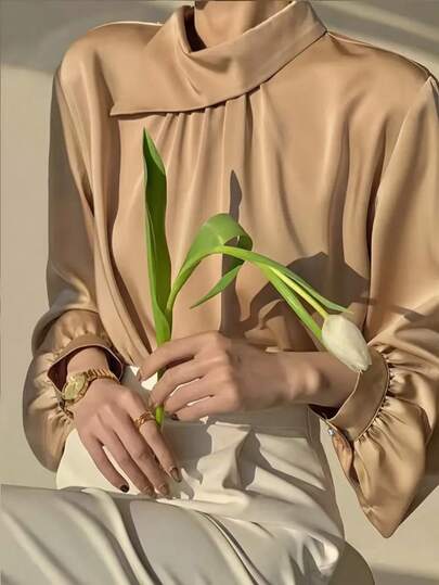 Blusa elegante de mujer de unicolor con mangas de farol y corte holgado