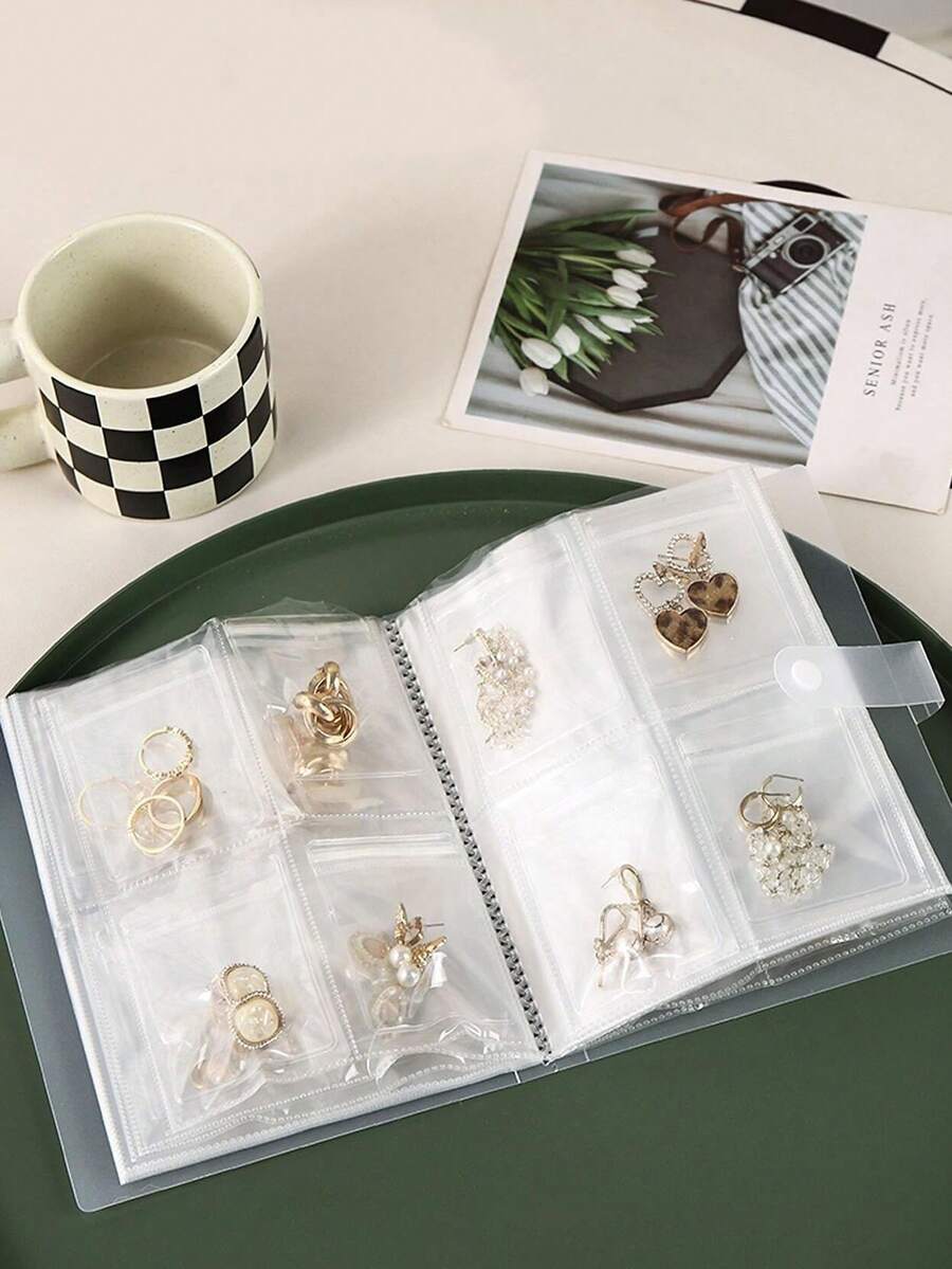 [كتاب مجوهرات محمول] كتاب تخزين مجوهرات محمول بشبكة 160 خلية شفافة | ألبوم بأقسام متعددة من البلاستيك للأقراط والخواتم والقلائد - تخزين مضغوط للسفر والمنزل، تخزين المجوهرات، لف المجوهرات مع إغلاق آمن بأزرار، ضروريات السفر، اكسسوارات السفر، حقائب السفر، عودة إلى المدرسة، لوازم المدرسة، صندوق مجوهرات (بدون كيس سحاب)