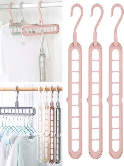 Cabide multifuncional de 9 furos com design giratório para organizar camisas e blusas (1/4 peças). Cabide dobrável de plástico para guarda-roupa, ideal para armazenamento doméstico, economiza espaço, estrutura leve e durável, fácil de montar, cabide dobrável para dormitórios, apartamentos pequenos e interiores residenciais, estilo minimalista, solução versátil para organização diária, mantém as roupas organizadas e sem amassados, compatível com armários e varões padrão, otimiza a organização de prateleiras e varões, adequado para viagens e uso doméstico, fácil de limpar e manter, atende às necessidades de armazenamento sazonal, combina com decoração minimalista.