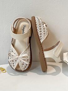 A Pair Of Summer Girls' Sandals. The Upper Is Made Of Leather And White Lace, With A Bow At The Toe And A Hook And Loop Strap Design For Easy Putting On And Taking Off. The Brown Sole Is Decorated With Patterns. The Overall Style Is Sweet And Cute, Suitable For Daily Wear By Children Aged 3 To 12. - Beige - View 7