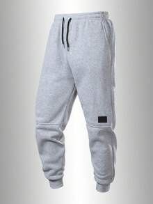 男士休闲跑步裤，配有可调节抽绳、侧袋和品牌标识贴片，适合健身、慢跑、训练和休闲穿着。 - 淺灰色 - 查看 3