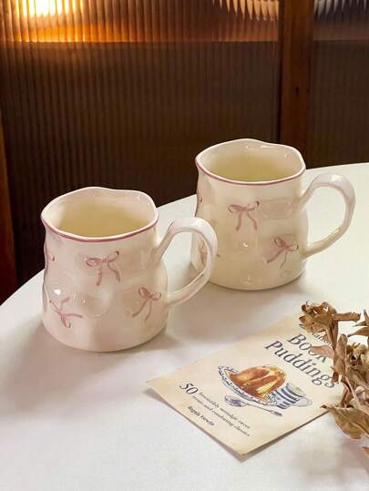 1pc Asymmetrical Ceramic Mug With Bowknot Design, Suitable For Home Breakfast, Milk, Oatmeal, Afternoon Tea, Coffee, Latte, Juice, Beverage, Couple Gift Cup