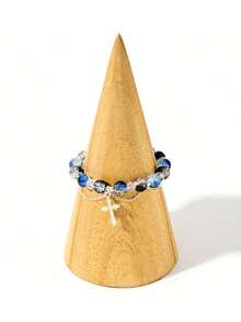 1pc Cool Blue Cross Bracelet. Transparent Blue Crystals Are Strung Together To Form The Chain, Adorned With A Silver Cross Pendant, Exuding A Cool And Crisp Vibe. The Blue Hue Resembles The Deep, Luminous Depths Of The Ocean, While The Cross Features Clean, Sharp Lines. The Silver Chain Is Delicate And Hugs The Wrist Comfortably. Under The Play Of Light And Shadow, The Crystals Refract Delicate Blue Hues, And The Silver Accents Shimmer With A Matte, Cool White Glow. Whether Worn Alone Or Layered With Other Pieces, It Evokes A Sense Of Detachment And Minimalist Elegance, Perfectly Complementing Minimalist Outfits And A , Tranquil Aesthetic.Perfect Gift For Birthdays, Holiday Gifts, And Parties. Suitable For Daily Wear And Holiday Celebrations, Suitable For All Seasons, And Is An Ideal Choice For Holiday Accessories. - Blue - 查看 6