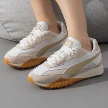 Puma أحذية رياضية خفيفة الوزن بتصميم بتشوورك ثماني الأرجل للجنسين - أبيض برتقالي - مشاهدة 1