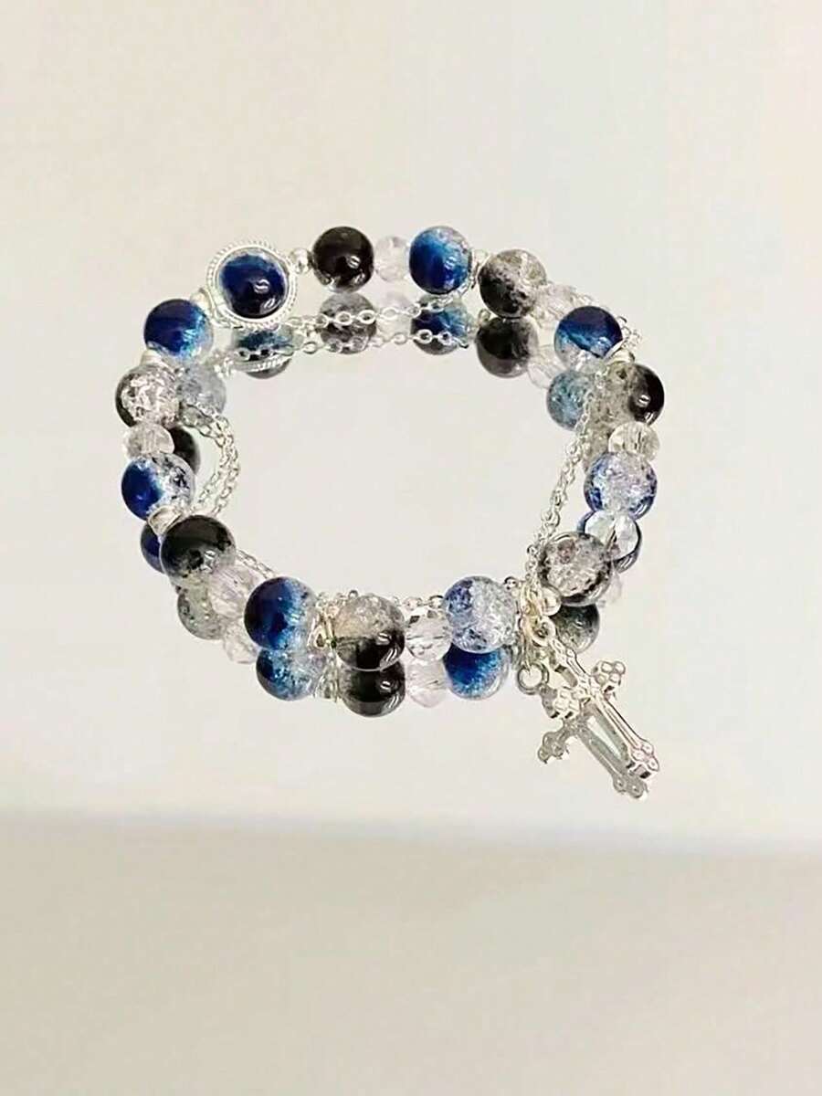 1pc Cool Blue Cross Bracelet. Transparent Blue Crystals Are Strung Together To Form The Chain, Adorned With A Silver Cross Pendant, Exuding A Cool And Crisp Vibe. The Blue Hue Resembles The Deep, Luminous Depths Of The Ocean, While The Cross Features Clean, Sharp Lines. The Silver Chain Is Delicate And Hugs The Wrist Comfortably. Under The Play Of Light And Shadow, The Crystals Refract Delicate Blue Hues, And The Silver Accents Shimmer With A Matte, Cool White Glow. Whether Worn Alone Or Layered With Other Pieces, It Evokes A Sense Of Detachment And Minimalist Elegance, Perfectly Complementing Minimalist Outfits And A , Tranquil Aesthetic.Perfect Gift For Birthdays, Holiday Gifts, And Parties. Suitable For Daily Wear And Holiday Celebrations, Suitable For All Seasons, And Is An Ideal Choice For Holiday Accessories. - Blue - 查看 1