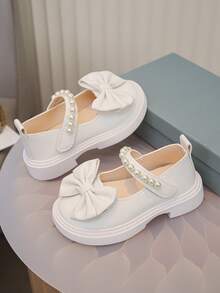 Zapatos de cuero lindos y de moda para niñas, zapatos planos cómodos para la escuela y uso al aire libre con decoración de moño en color blanco puro, zapatos casuales para bebés, zapatos para todas las estaciones, recomendados para volver a la escuela