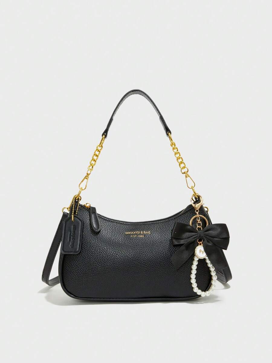 新款时尚女士单肩包，采用多功能防水PU材质，饰有黑色蝴蝶结吊坠和字母设计，可用作单肩包或腋下包，适合购物、通勤、外出、聚会等各种场合。 - 黑色 - 查看 1