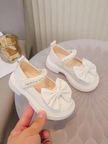 Zapatos de cuero lindos y de moda para niñas, zapatos planos cómodos para la escuela y uso al aire libre con decoración de moño en color blanco puro, zapatos casuales para bebés, zapatos para todas las estaciones, recomendados para volver a la escuela