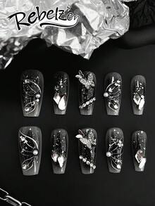 10片装手工按压式美甲贴片，长棺材形，手工3D立体浮雕及手绘工艺，饰有3D蝴蝶、水钻、珍珠、银箔装饰，黑色渐变及银色闪粉底色，四季皆宜，适合甜美酷女孩、哥特风爱好者、派对、约会及日常佩戴，是甜美酷女孩、蝴蝶爱好者、哥特风爱好者及优雅哥特风粉丝的理想之选。套装包含一瓶果冻胶和一把指甲锉。 - 彩色 - 查看 3