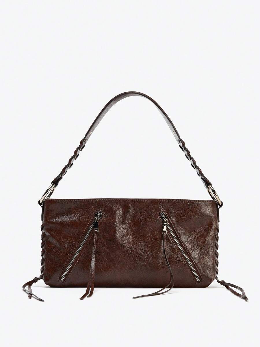 ELLA GRACE - Geantă de umăr cu curea și inele metalice pe corp. Buzunare cu fermoar în față. Curea de umăr. Buzunar interior. Închidere cu fermoar.