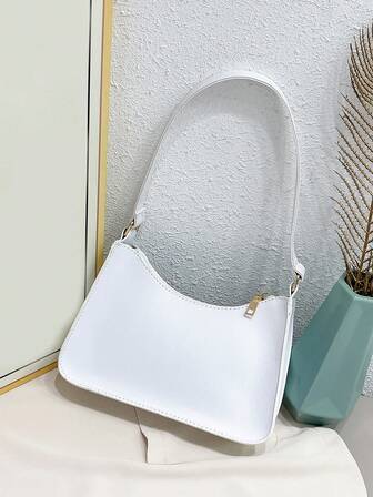 Minimalistyczna, modna torba typu bagietka na jedno ramię z możliwością noszenia pod pachami