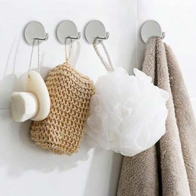 Conjunto de 4 ganchos para pendurar em portas, cozinhas e banheiros. Gancho para chapéus e casacos. Gancho de parede em ângulo reto com base redonda, sem necessidade de pregos. Acabamento metálico durável. Organizador multiuso para hall de entrada, armário e penteadeira. Montagem na porta que economiza espaço com base redonda. Fácil instalação. Mantém chapéus, casacos, toalhas, bolsas, cachecóis e acessórios organizados e acessíveis. Acessório moderno para decoração de casa, que otimiza o armazenamento. Versátil para uso interno e externo, com design robusto e resistente.