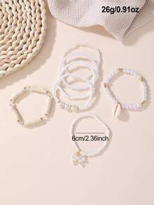Set de 7 piezas de pulseras para niñas con cuentas con diseños de corazón, mariposa, concha y perla - Blanco - Ver 4