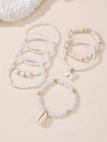 Set de 7 piezas de pulseras para niñas con cuentas con diseños de corazón, mariposa, concha y perla - Blanco - Ver 5