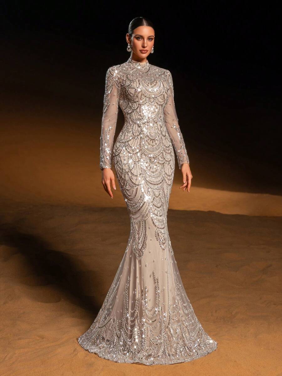 Faeriesty Đầm dạ hội đuôi cá sang trọng, được tô điểm bằng những hạt cườm và sequin lấp lánh hình vỏ sò tinh xảo, thiết kế cổ cao, kiểu dáng dạ hội trang trọng xa hoa, lý tưởng cho các sự kiện thảm đỏ, đám cưới, dạ tiệc cao cấp và các buổi họp mặt đêm trang trọng mùa xuân.