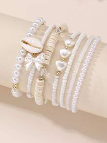 Set de 7 piezas de pulseras para niñas con cuentas con diseños de corazón, mariposa, concha y perla - Blanco - Ver 1
