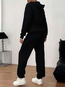 Conjunto  deportivo de pantalones rectos,  con sudadera de manga larga con capucha. - Negro - Ver 2