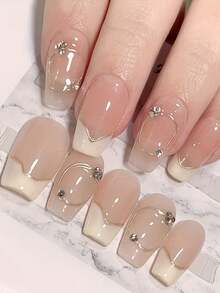 10片手工制作的法式美甲贴片，不对称白色底金色线条，点缀几颗小水晶，短款按压式美甲贴片，可重复使用，可卸除，附赠工具包，适合日常佩戴和节日送礼，送给爱美的女孩，圣诞礼物，美甲用品 - 彩色 - 查看 1