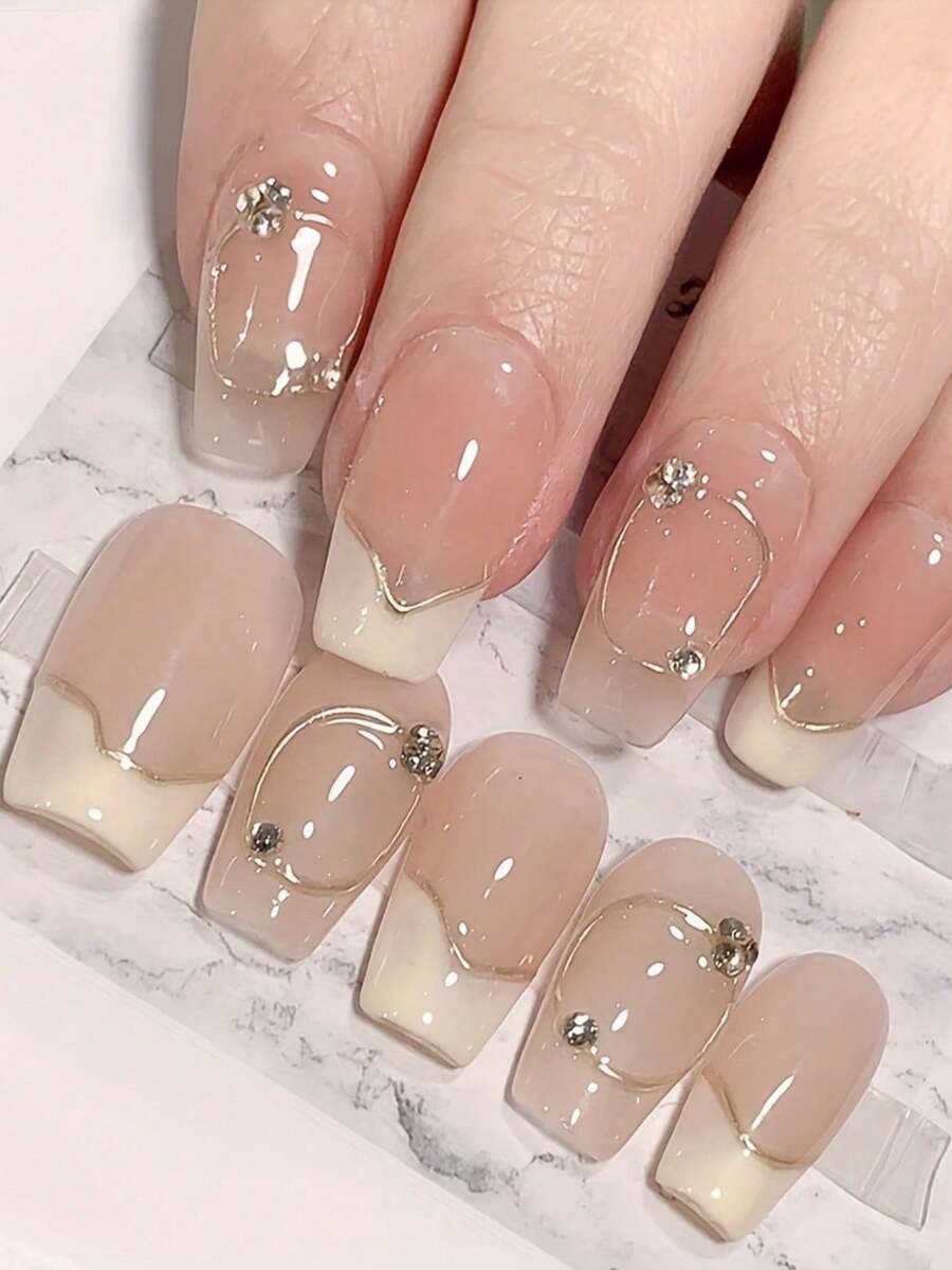 10片手工制作的法式美甲贴片，不对称白色底金色线条，点缀几颗小水晶，短款按压式美甲贴片，可重复使用，可卸除，附赠工具包，适合日常佩戴和节日送礼，送给爱美的女孩，圣诞礼物，美甲用品 - 彩色 - 查看 1