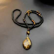 Collana con ciondolo stile boho dell'albero della vita - pietra naturale occhio di tigre, lavorata a mano con ambra ovale, accenti dorati, colore nero e arancione-marrone, per collane da uomo e donna, accessori donna, gioielli donna