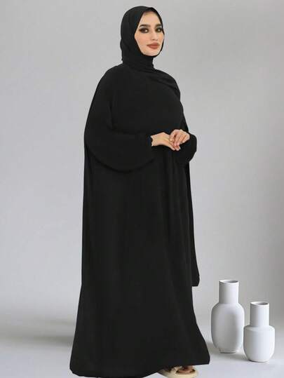Classic Black Arabic Robe With Matching Headscarf, One-Piece Design Minimalist And Elegant. Loose Fit Suitable For Diverse Body Types, Comfortable. Fabric With Good Drape And Natural Fluidity, Long Sleeve And Full-Length Silhouette, Catering To Traditional Muslim Clothing Needs, Suitable For Daily Activities, Prayers, And Other Occasions. Minimalist Yet Ceremonial, Easily Interpreting A Traditional And Practical Styling.