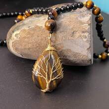 Collana con ciondolo stile boho dell'albero della vita - pietra naturale occhio di tigre, lavorata a mano con ambra ovale, accenti dorati, colore nero e arancione-marrone, per collane da uomo e donna, accessori donna, gioielli donna