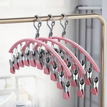 10件装夹式裤架，弧形防风设计，防止衣物滑落；超强耐用，适用于瑜伽裤、打底裤、长裤、裙子、运动服和日常服装；防滑夹子，易握设计，节省空间，结实耐用，是居家、宿舍和洗衣房的理想之选，可保持衣物整齐，最大限度地利用衣柜空间；兼容多种杆型；挂钩滑动顺畅；采用防锈钢材，易于维护。