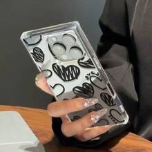 Funda para móvil con diseño de grafiti: corazón y cubo negros. Compatible con phone 16 Pro, 15, 14, 13 y 12. Diseño texturizado, estilo vintage, con cuentas. Funda elegante y artística. Protector premium y duradero. Ideal para entusiastas de la moda y usuarios. - transparente - Ver 5