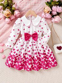 Rochie pentru fete cu imprimeu de inimă, guler Peter Pan, albă, imprimeu integral cu inimioare roz, guler Peter Pan și design cu fundă mare, stil dulce de prințesă. Potrivită pentru petreceri de ziua de naștere, dans, spectacole școlare. Primăvara, toamna, iarna.