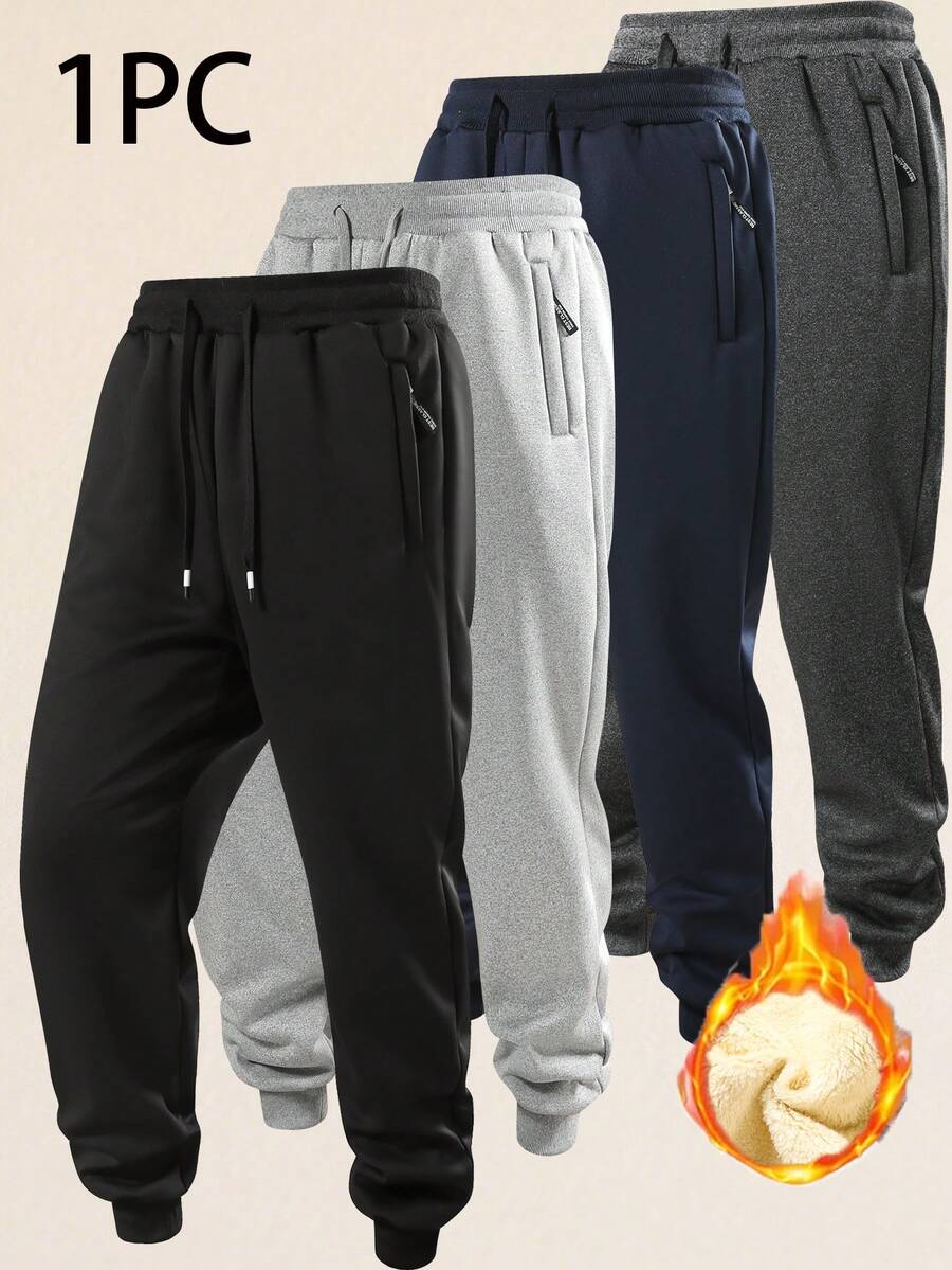 男士黑色抽绳运动裤，弹性腰带，休闲运动风，适合日常穿着和锻炼。