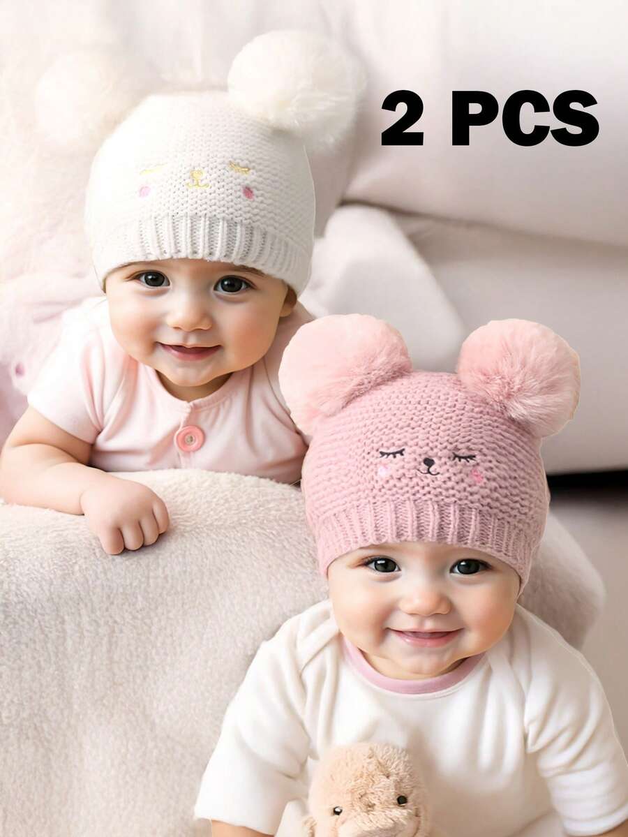 2 pezzi Cappellino neonato/bambino con doppia pallina, occhi chiusi e viso sorridente ricamato, berretto in maglia per neonati, bambini piccoli, inverno caldo cappello in maglia per bimbi e bimbe - Multicolore - Visualizzare 1