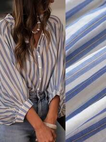 这款女士轻奢条纹衬衫非常适合叠穿。它采用宽松的灯笼袖设计，休闲时尚，适合日常穿着。面料为半透明材质。