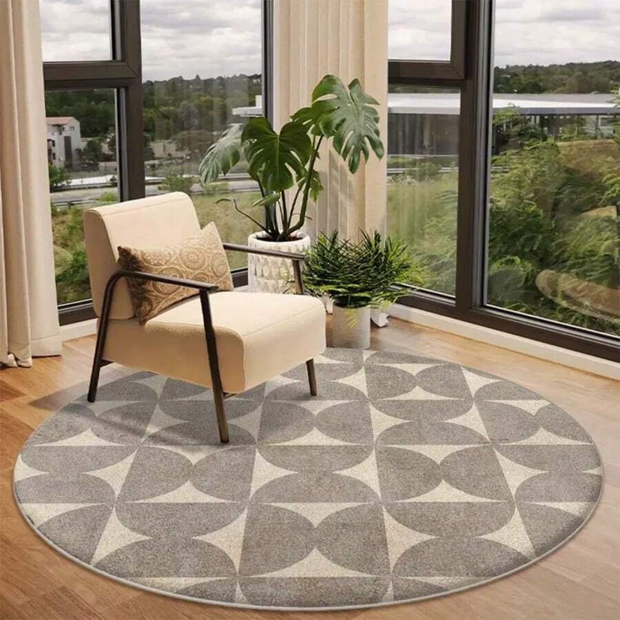 Um tapete redondo com padrão geométrico. O tapete apresenta um esquema ...