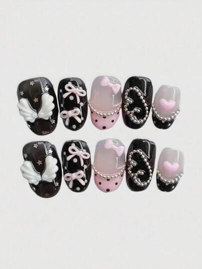 Sweet, Cool, Cute And Sweet Lolita Style Autumn-Winter New Nail Set. Ten Short Oval Handcrafted Pressed Fake Nails. Classic Black And White Color Scheme. Paired With White Small Wings, Pink Bowknots, Hand-Painted Pink French Edge, Polka Dot Design