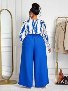 BIUBIU Bộ đồ nữ cỡ lớn thời trang gồm áo kẻ sọc và quần ống rộng xếp ly, thiết kế tối giản, phù hợp cho công sở, mùa xuân, thu và đông. Cũng thích hợp cho đi chơi hàng ngày, hẹn hò, Giáng sinh, tiệc tùng, năm mới và các dịp khác. Thanh lịch - Màu xanh lam - Xem 2