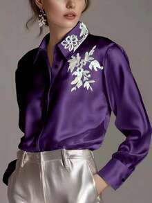 بلوزة ساتان أنيقة للنساء مع طوق مطرز وأمام أزرار