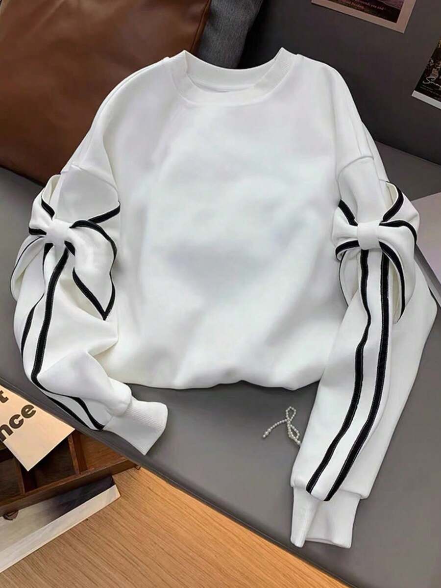 13-16 岁女孩蝴蝶结条纹运动衫，甜美别致的校园风格，蝴蝶结袖子细节，舒适百搭