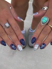 24 piezas. Pegatinas de uñas con relieve ovalado. Estilo dulce. Lunares azules con lazo. Adecuado para todas las estaciones (primavera, verano, otoño, invierno). Decoración de uñas ligera, producto de cuidado de uñas DIY. Adecuado para uso diario de niñas/mujeres. Adecuado para ocasiones como citas, vida diaria, fiestas, vuelta al colegio, etc. + 1 pegamento de gel + 1 lima de uñas para decorar las uñas y hacer arte de uñas DIY!