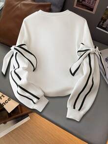 13-16 岁女孩蝴蝶结条纹运动衫，甜美别致的校园风格，蝴蝶结袖子细节，舒适百搭