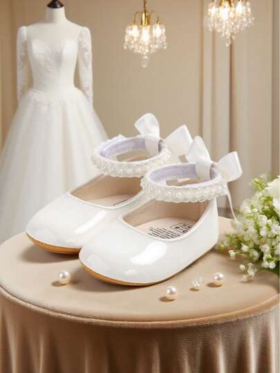 Nuevos zapatos planos tipo Mary Jane para niñas, diseño con moño, suela de cuero sintético suave antideslizante, zapatos para caminar de bebé y niña pequeña, decoración con cinta de satén con perlas