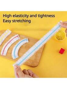 100 片一次性保鲜膜，用于保持剩余食物新鲜，具有弹性封口和自密封功能，适合覆盖碗和盘子，家庭使用